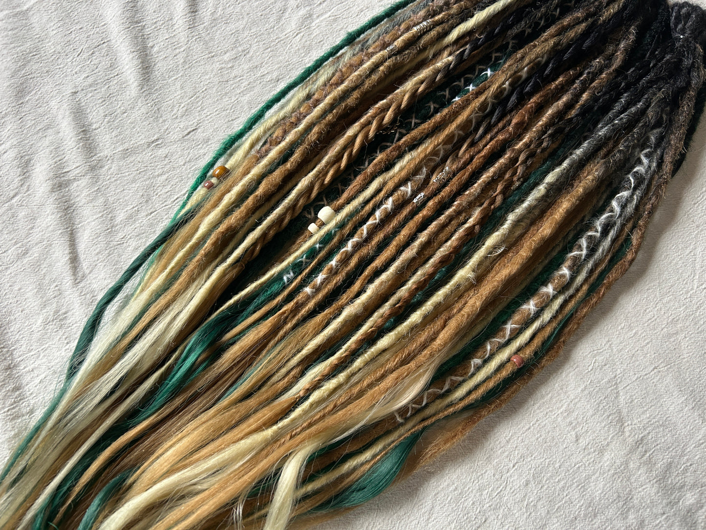 Livana Dreadlocks in green blonde and brown handmade synthetic dreads custom order Forest Feeling with curly ends