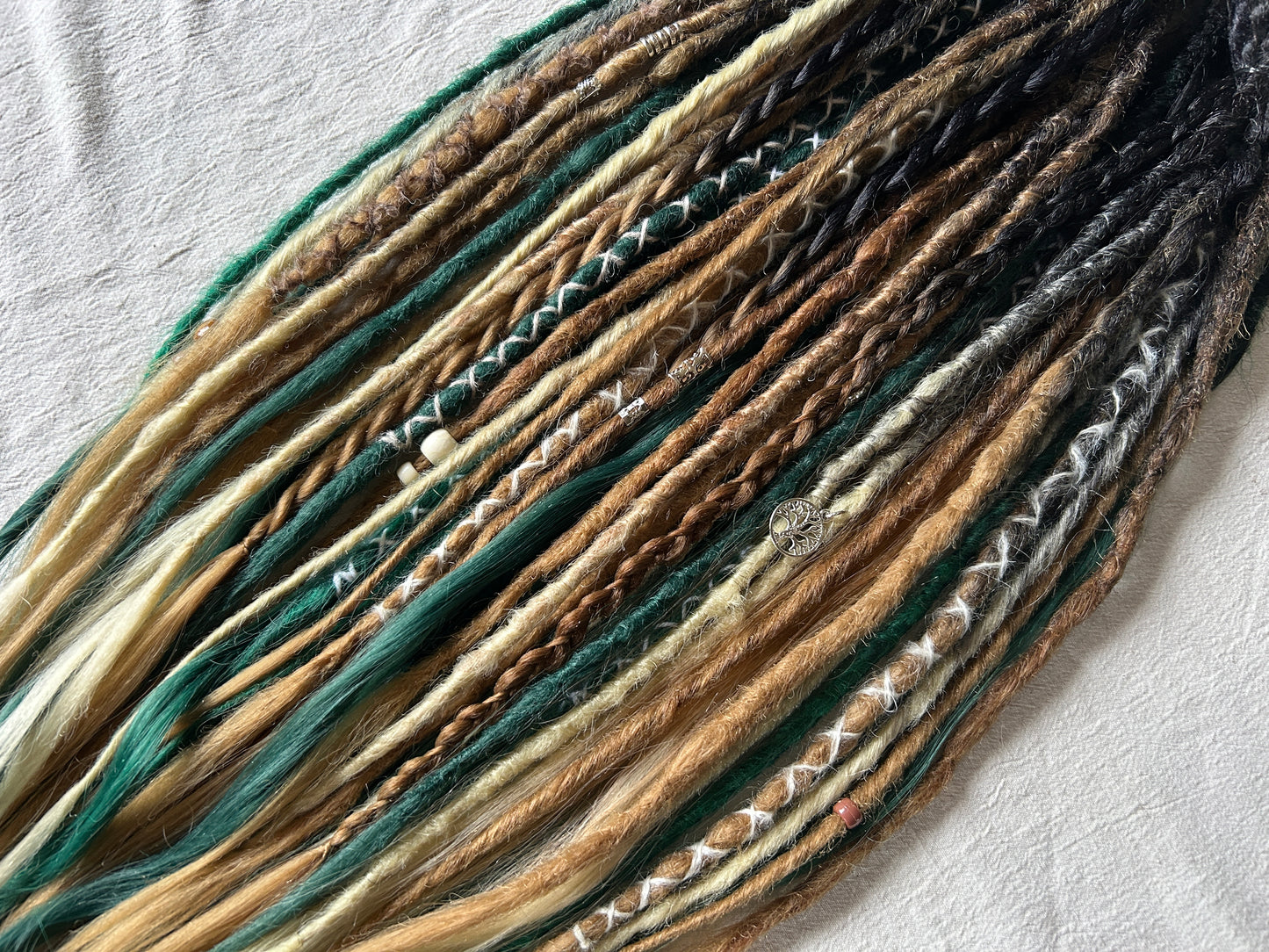 Livana Dreadlocks in green blonde and brown handmade synthetic dreads custom order Forest Feeling with curly ends